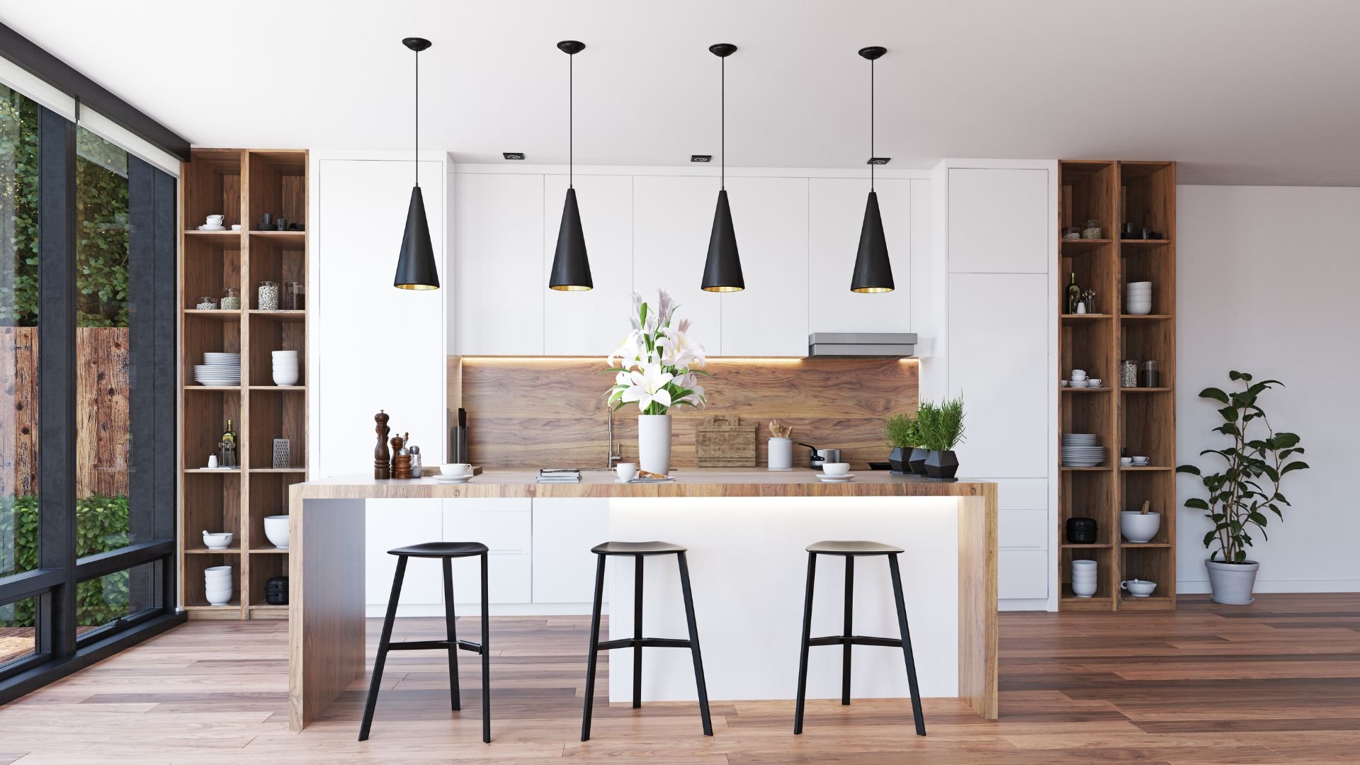 Modern white kitchen with wooden accents, black pendant lights, and bar stools